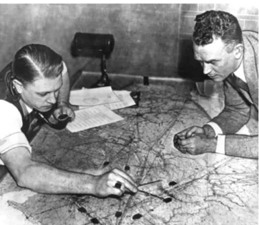 Figure 3-4.Air traffic controllers circa 1935 tracking aircraft using small paperweights on a table top  aviation chart