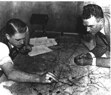 Figure 3-4.Air  traffic controllers  circa  1935 tracking aircraft using small  paperweights  on  a table top aviation  chart
