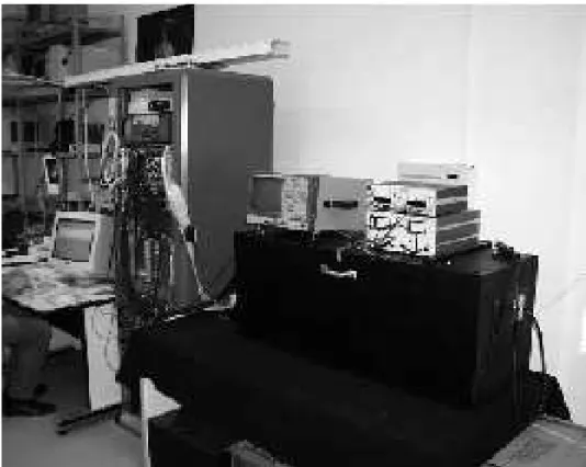 Figure 3. Overall view of the test bench. The black box, closed, on the right. On the left the electronics for the DAQ.