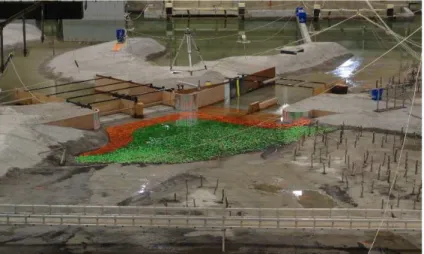 Figure 1: Springbank Physical Model, view facing downstream; Diversion structure (left) and Main  Channel structure (right) can be seen in the photo as well as the wooded portions of the floodplains  with scaled trees placed vertically within the grout