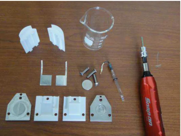 Figure 12: Photograph of a disassembled cell showing all components including the  beaker, Teflon fillings and a dynamometric screwdriver used to control the pressure  applied to the internal cell 