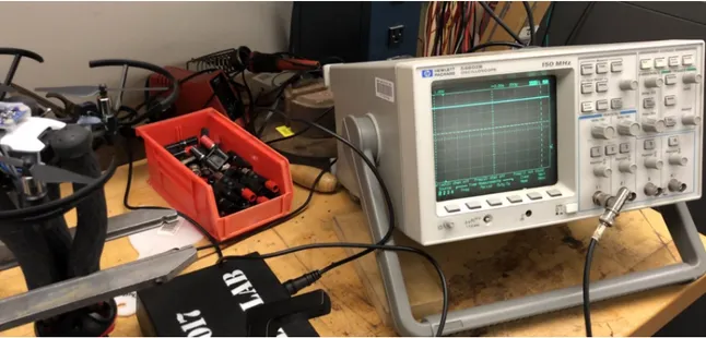 Figure 3-6: The Tello on the bench for RPS calibration by an oscilloscope and beam break sensor.