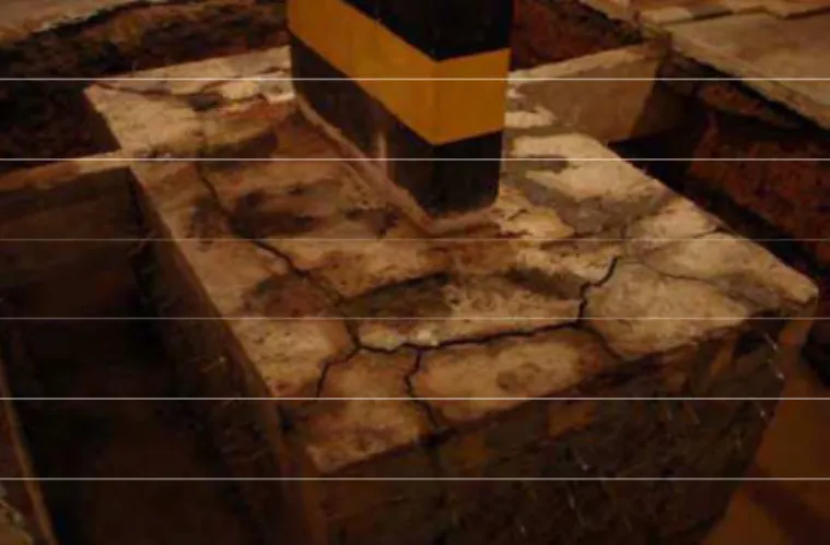 Figure 1. Building foundation with AAR-induced cracks under repair by epoxy injection (Andrade 2006)