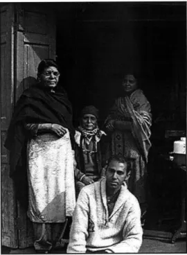 Fig.  3.  Kasturi  Lal  Sharma  (seated,  center) surrounded  by  his  family  at  his  home  in Moti  Ram  Katra,  Amritsar.