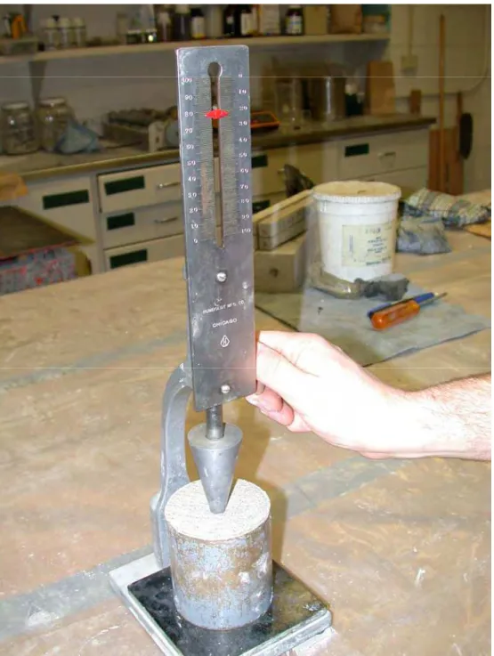 Figure 4. The Vicat cone is dropped into a cylinder of mortar and the depth of penetration  into the mortar provides an indication of the consistency of the mortar