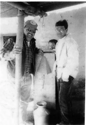 Figure  1:  Arjun  G.C. of Hope  For the  Nation  (left),  BioSand  Filter  (middle) and  a technician (right) in  Nepal.