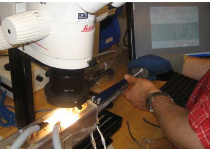 Figure 2.  Initial wedge insertion into DCB specimen in- in-stalled in temperature-controlled chamber