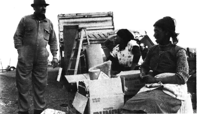 Figure 3  A  family, with  possessions  packed,  makes the  move to  a bantustan.