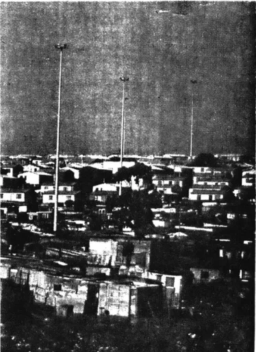 Figure 8  Controlled  slums.  The  first  infrastructural  &#34;service&#34;  - the police  surveillance  cameras.