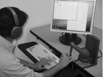 Figure  1.  Photograph  of  the  BlindAid  system  in  use.  The  user hears spatialized sounds, as if physically standing in the simulated space,  while  touching  a  small  scale-model  of  the  space  (~10  cm across) using the Phantom