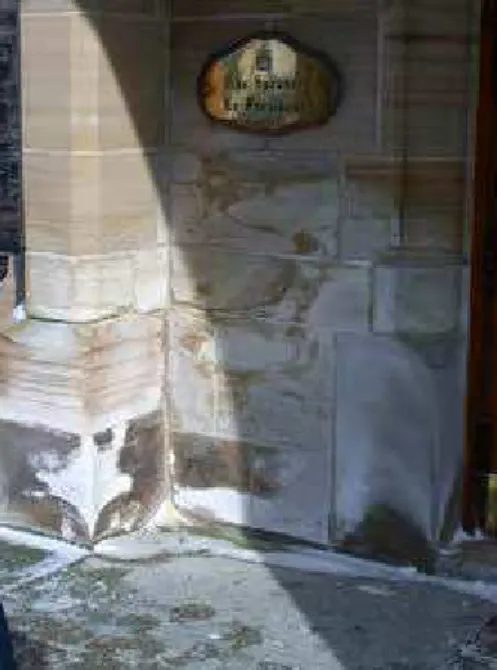 Figure 3. Salt damage to stone and mortar is apparent beside an entryway where salt  is used to remove ice in the winter