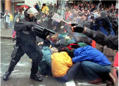 Figure 7. Protestors clash with police at the famous &#34;Battle of  Seattle&#34; anti-globalization protest in 1999 (Brown 2014) 