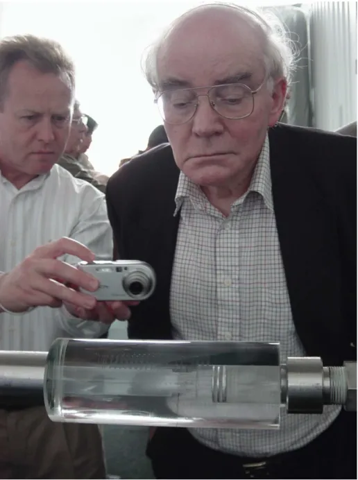 Figure 3-2: M. Fleischmann observing a damaged cell, provided by S. B. Krivit, c New Energy Times, use permitted for non-commercial educational purposes