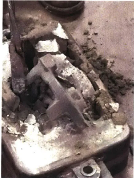 Figure 15: After  metal  has  been  poured  and the part has cooled  it is removed from the sand.