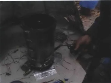 Figure  8: The  testing  unit  underneath  a hood.  The  gas  torch  was  used to  light  the  pine needles.