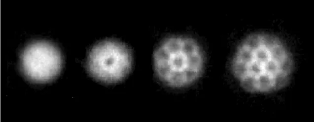 Fig. 2 Nucleation of vortices for an increasing rotation speed (from left to right). The experiments were done by a group led by Jean Dalibard in 2001 at the Kastler Brossel laboratory (ENS Paris, France).