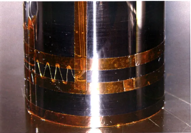 Figure 3-8:  A  75  pm  gold  bonding wire  masked  onto  a carbon crucible.