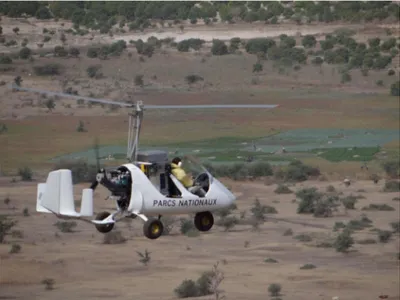 Figure 3. A gyrocopter releasing sterile tsetse male Glossina palpalis gambiensis in Senegal thanks to an  automatic release machine (photo by Jérémy Bouyer).
