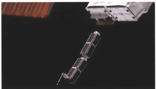 Figure  1.1  Two  30-cm  long  satellites,  Planet  Labs  Doves,  being  launched by  the  ISS