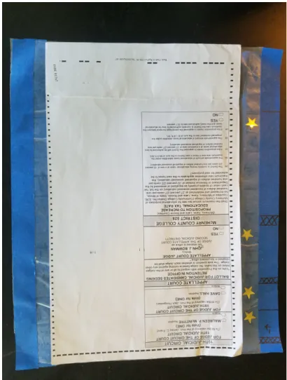 Figure 7: A ballot with added stickers on the side. The nonstick paper makes it easier to peel them out, and the indicators next to them allow voters to quickly check which races they haven’t voted on yet.