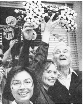 Figure 2. Cram and colleagues (one brandishing  a CPK model) at the announcement of the  No-bel Prize in 1987 (source: Lewin 1987.)