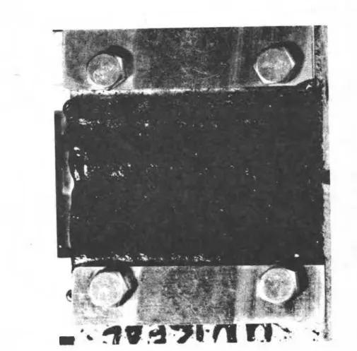 FIG. 2-Device  and concrete blocks (CGSB 37-GP-50M)  covered with hot-applied rubberized  asphalt  ready f i r   crack-bridging  test