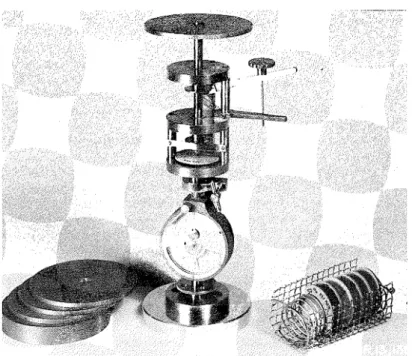 Figure  2(a).  Miniature  testing  machine  with  dead weights  for  loading  used  for  determining  Young's  modulus
