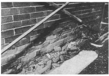 Fig ure  4.  Laminar break-up of  masonry units which were covered by  a  metal  flashing.