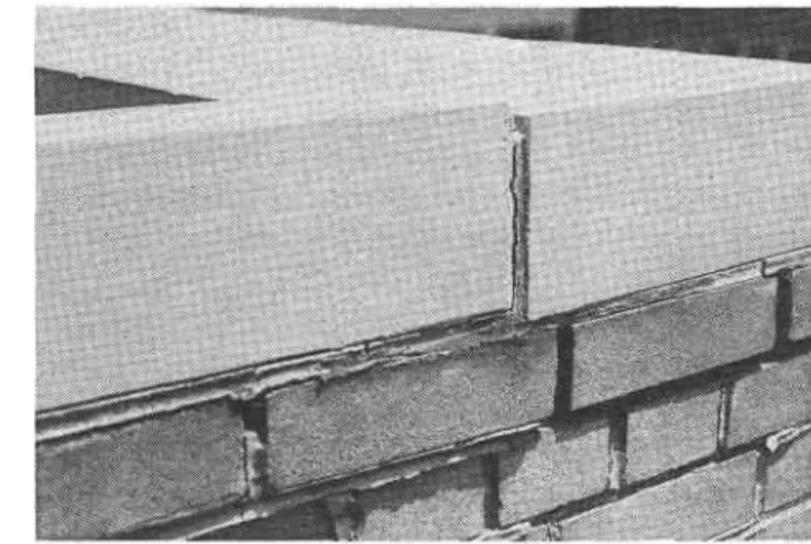 Figure  1.  Disruption of  masonry by  frost action  in wet  materials.