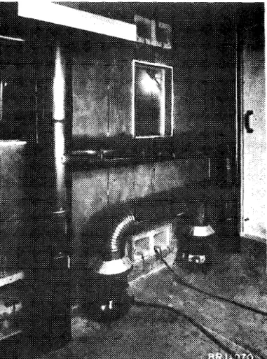Figure  9  Interior  sf  mock-up  showing  heat  ewehanger  with  two  stove  s  in operation