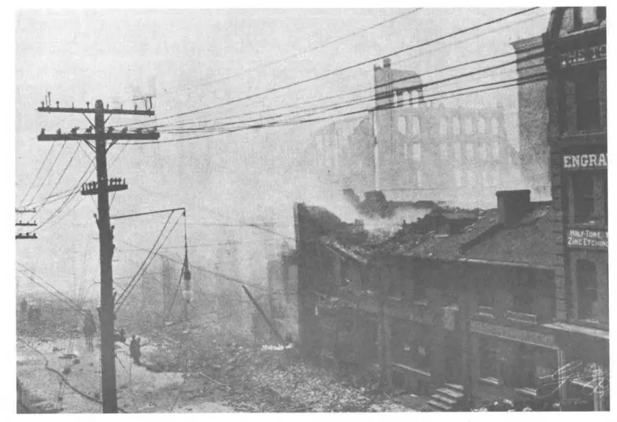Figure  4  The  fire  swept up  Bay  St.  to  s o m e   low  buildings  next toTthe  Toronto 
