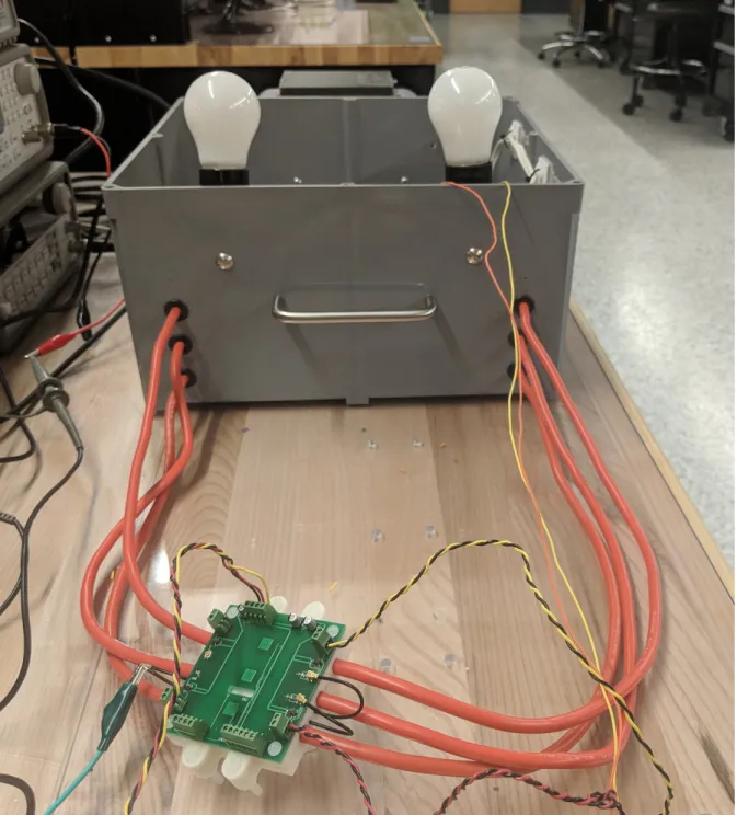 Figure 3-20: A photo of the detector attached to the cables of the lightbulb demo.