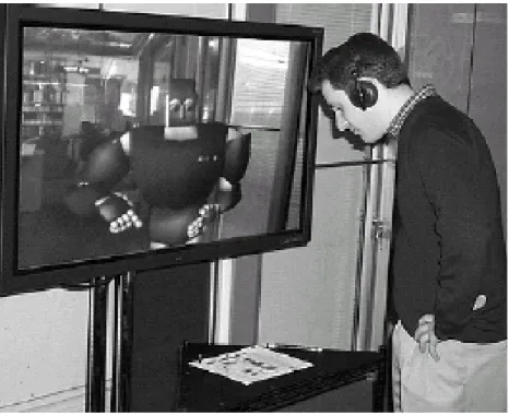 Figure 2-1: MACK was designed to study face-to-face grounding [69]. Directions are given by the avatar using a common map placed on the table which is highlighted using an over-head projector