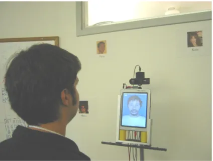 Figure 2-4: Multimodal kiosk built to experiment with Conversational tooltip. A stereo camera is mounted on top of the avatar to track the head position and recognize head gestures