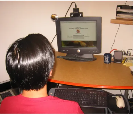 Figure 2-10: Experimental setup. A stereo camera is placed on top of the screen to track the head position and orientation.