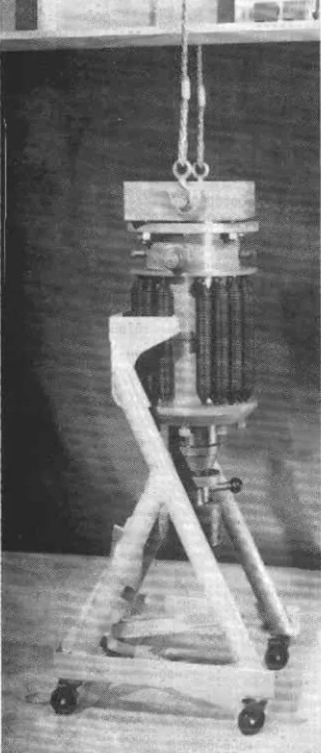 Fig.  9.  Fifty-ton  jack  being  lifted  from dolly  to  test  frame.