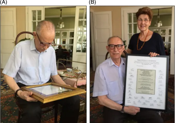 FIG. 1. Photographs of Dr. Oleh Hornykiewicz and Mrs. Christine Hornykiewicz holding framed greetings from ( A ) the Prime Minister of Canada Justin Trudeau and ( B ) several members of the neuroscienti ﬁ c community in Canada (photographed by M