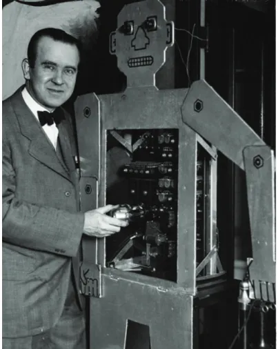 Figure 1.11: Televox, with his arm ready to lift the phone and his inventor Roy Wensley.