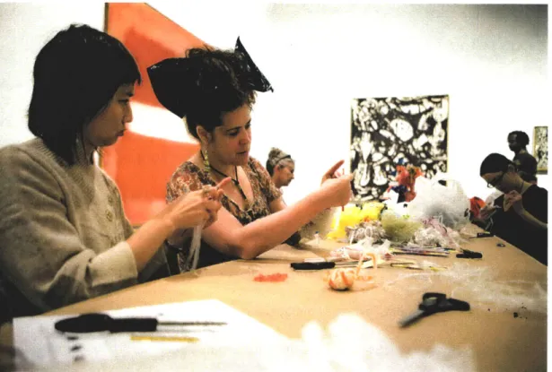 Figure 4.3.  &#34;Christine  Wertheim  of the Institute  for Figuring, center  left, leads a workshop  on crocheting plastic trash bags into coral-like  forms.&#34;  The author is seated on  the right.