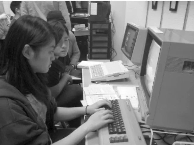 Figure 1. Students use home computers and (in the  background) videogame systems in the Trope Tank.