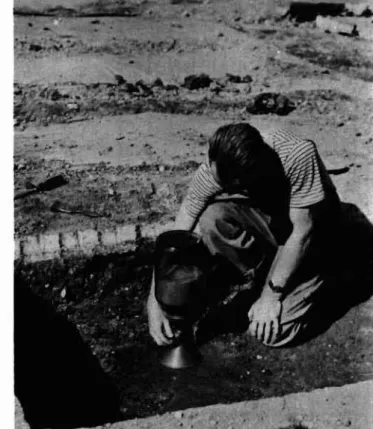 Fig. 4 Density test on sub- sub-grade using the sand density apparatus.