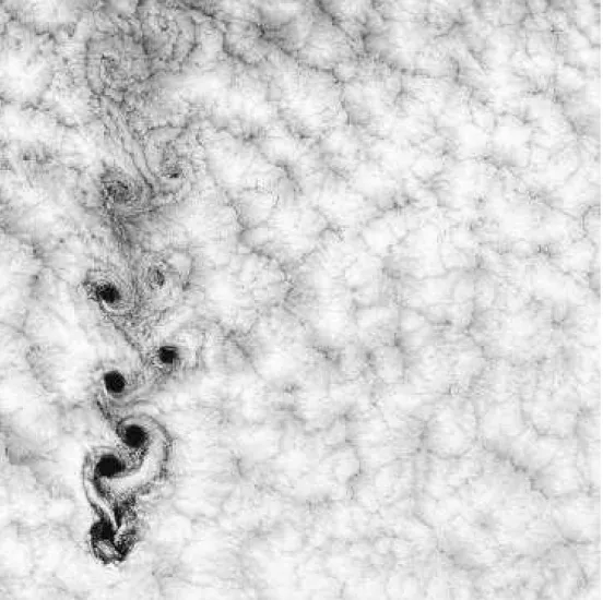 Fig. 1.13 – D´eveloppement d’une all´ee de B´enard–von K´arm´an dans le sillage de l’ˆıle d’Alejandro Selkirk culminant `a 1640 m au large des cˆotes chiliennes, aper¸cu dans une couche de nuages agissant comme traceur