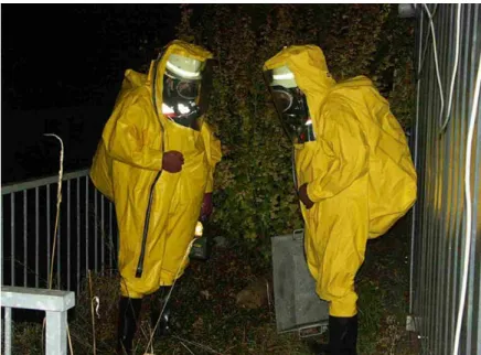 Figure 1-1: Example of personal protective equipment, including SCBA system, worn at the Fukushima site.