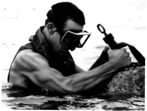 Figure 2.10: Navy  SEAL  loading a  shallow  water obstacle