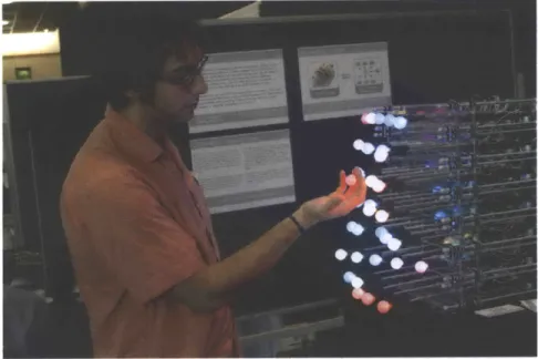 Figure  2-5:  Daniel  Hirschmann  with  Glowbits  (2004)  demo  at  Ubicomp  2004  (Image  cour- cour-tesy  of Tom  Igoe)