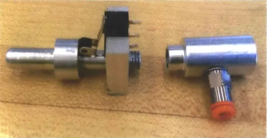 Figure 3-6:  Three  pieces  press fit together  (left)  and the fourth piece (right) that connects the  other three pieces to  both the  pneumatic  tubing  and the plunger