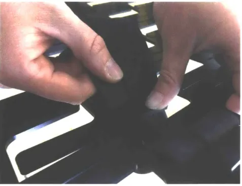 Figure 9:  The Loop  cushion  being  assembled.  The  Delrin tabs  are bent  slightly  to allow the  inner tubes  to be  woven  through  the  slots.