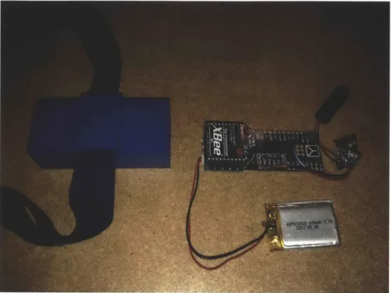 Figure 3-6: Haptic  device hardware,  consisting of Arduino  Fio,  battery, and vibration  motor and  fabricated  case