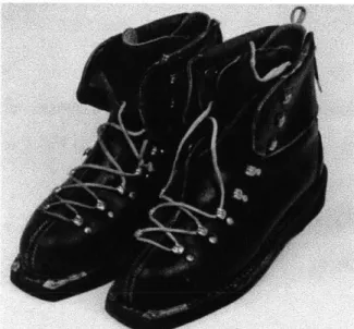 Figure 1:  A  pair of ski boots from the  1950's featuring a  leather design with a  laced enclosure!