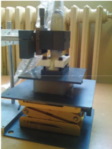 Figure 1: Measurement setup. The ultrasonic probe and a  compressor plate attached to it along with an actuator were 